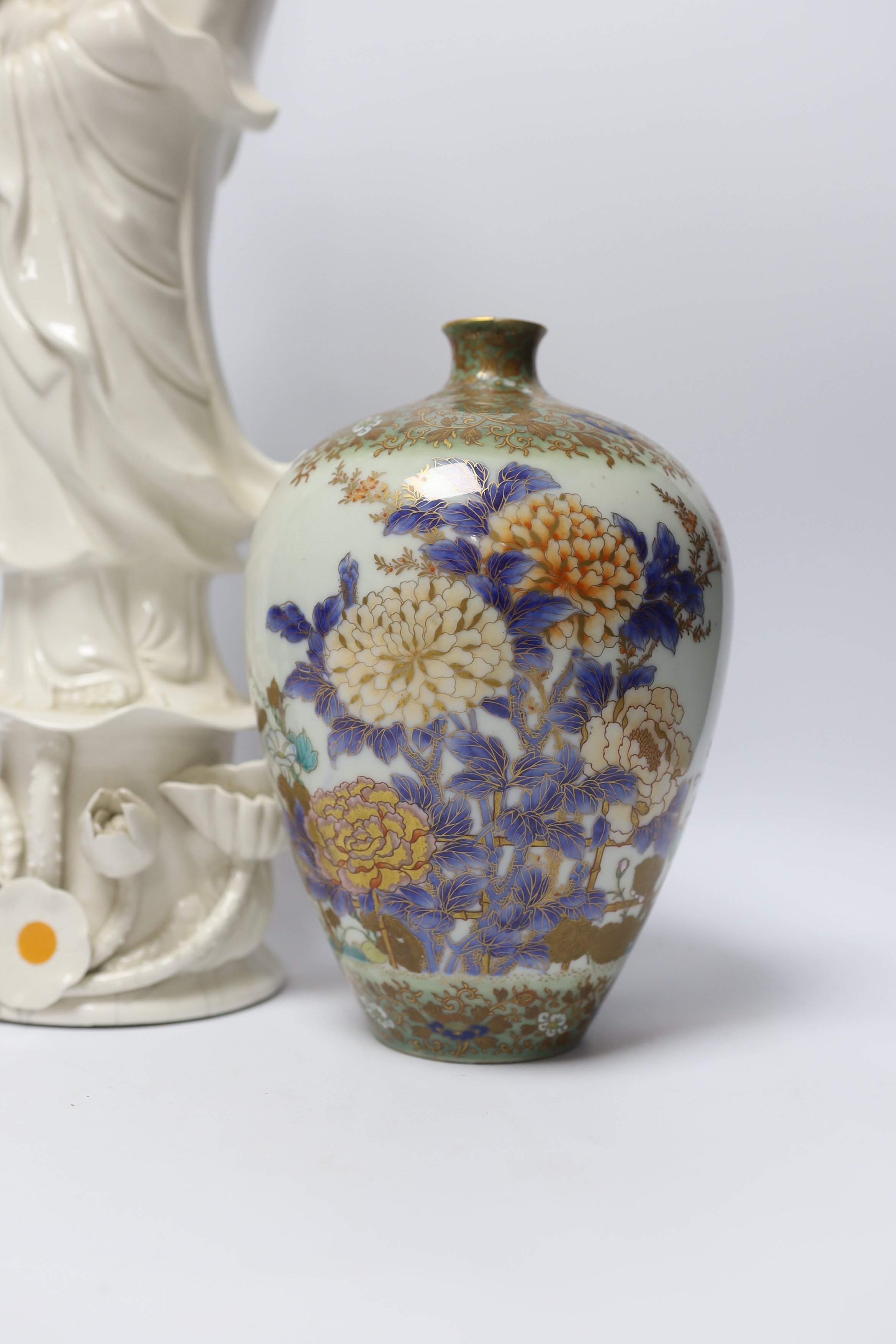 A 19th century Chinese blanc de chine figure of Guanyin, 20th century ‘dragon’ vase and a Japanese Meiji period vase, by Fukagawa, koransha mark, tallest 46.5cm
